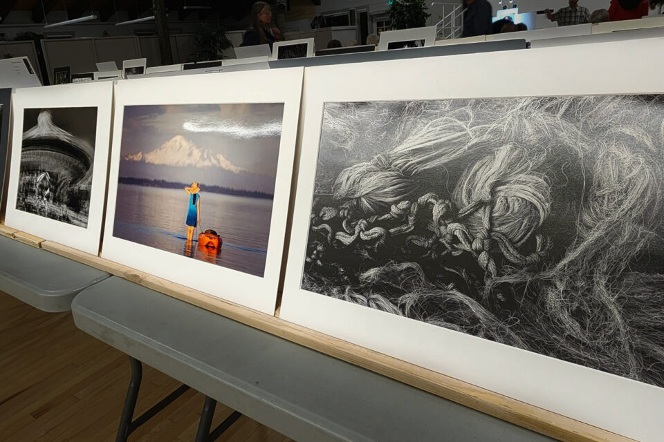 image of photographic prints propped on a table